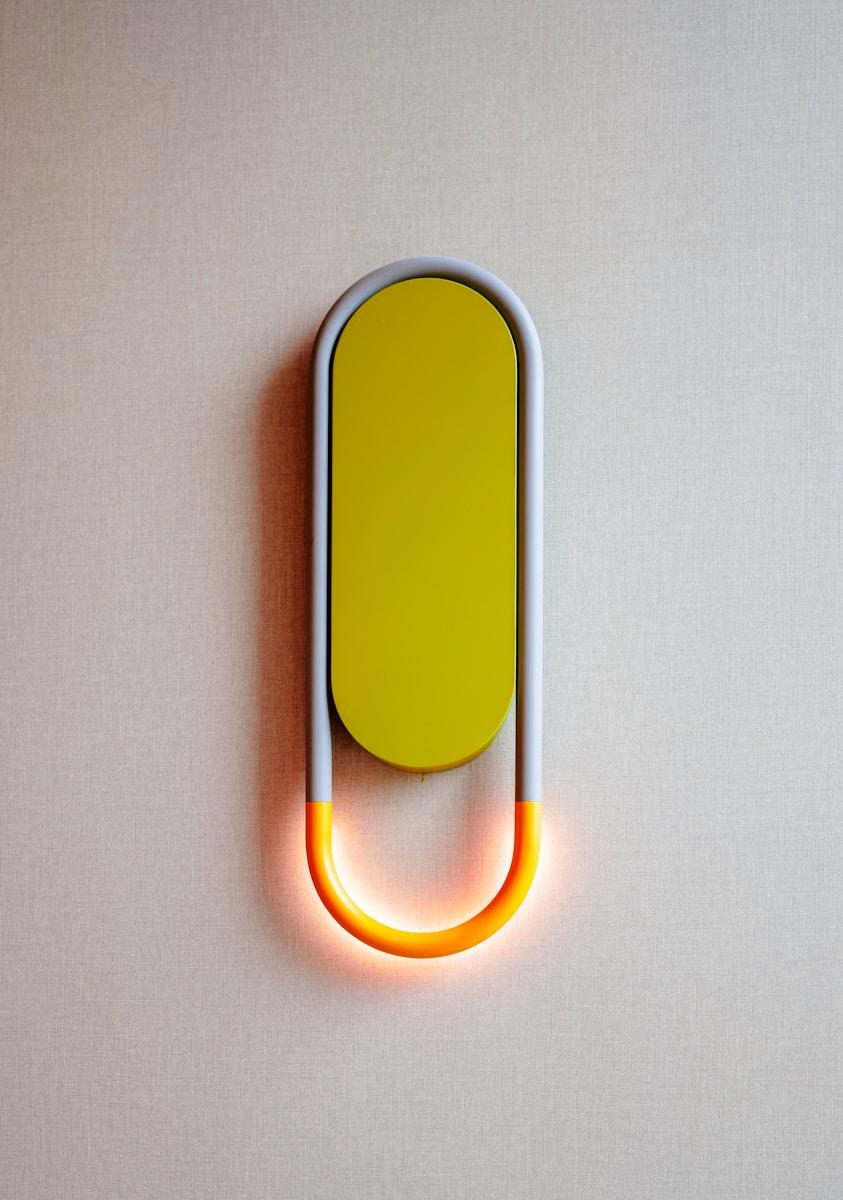 a yellow and white object on a white surface